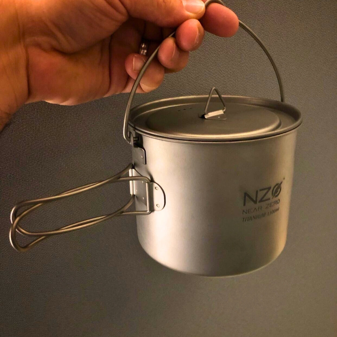 Near Zero Outdoor Gear titanium cooking pot, 1100 ml, lightweight cookware with a smooth metal finish, suitable for outdoor camping.