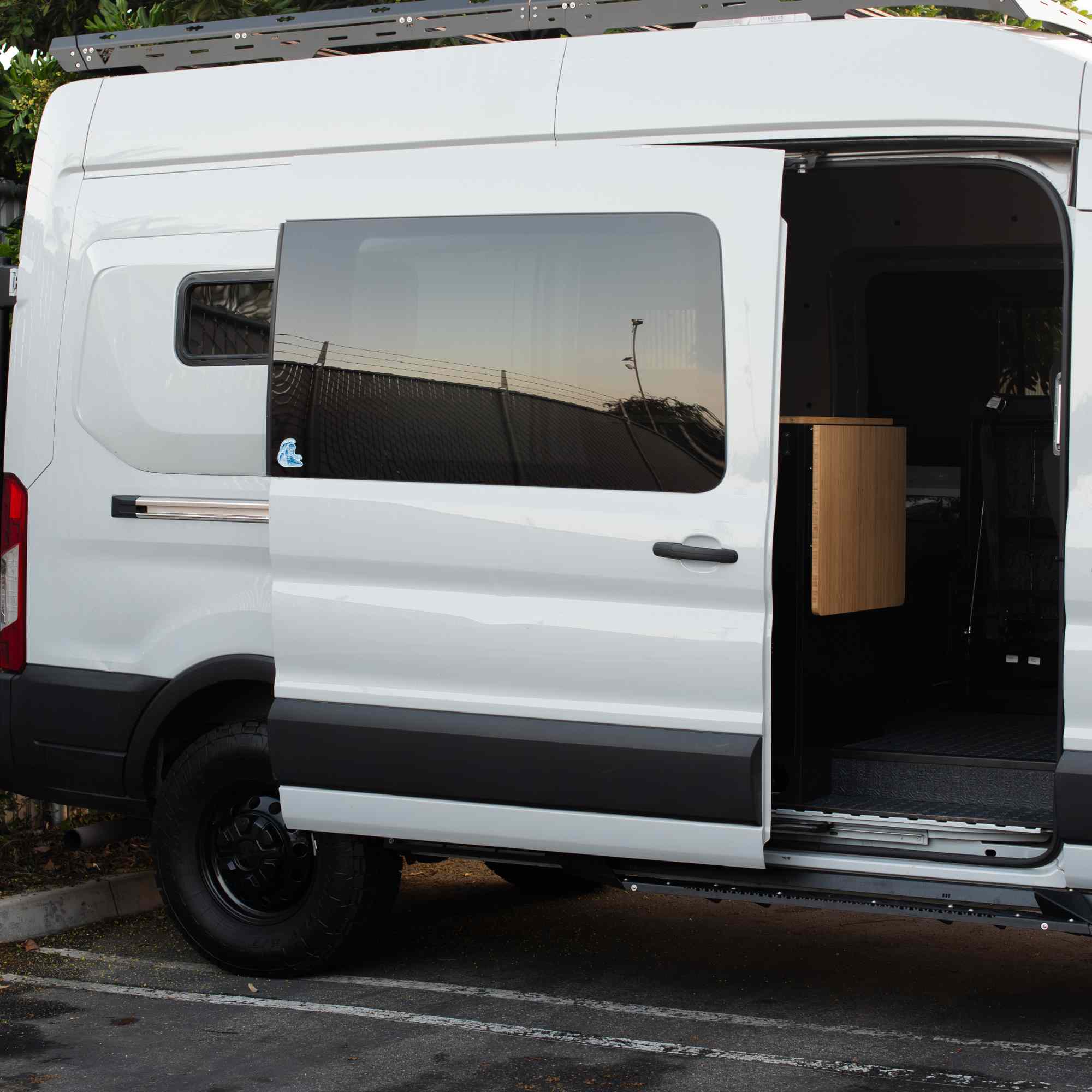 Universal Mid-Door Slider Kit by The Van Mart, showing metal sliding hardware and components for vehicle interior door installation.