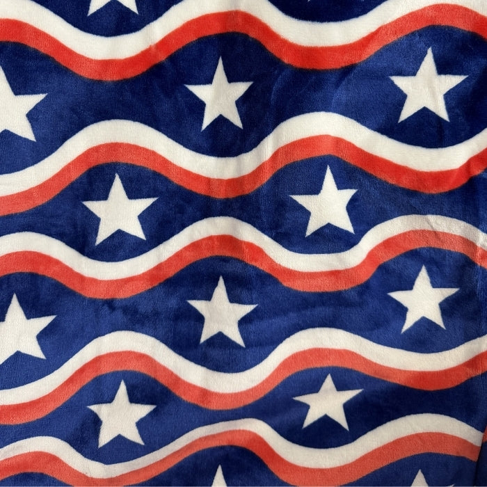 City Bonfires The Chair Blanket made of cozy USA polar fleece, shown draped over a chair for warmth and comfort.