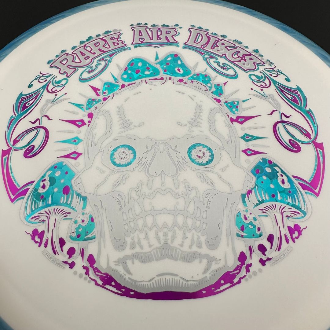 Fission Defy Crushin' Amanitas VIP 2.0 disc golf disc by Rare Air Discs, showing vibrant design and branding on the flight surface.
