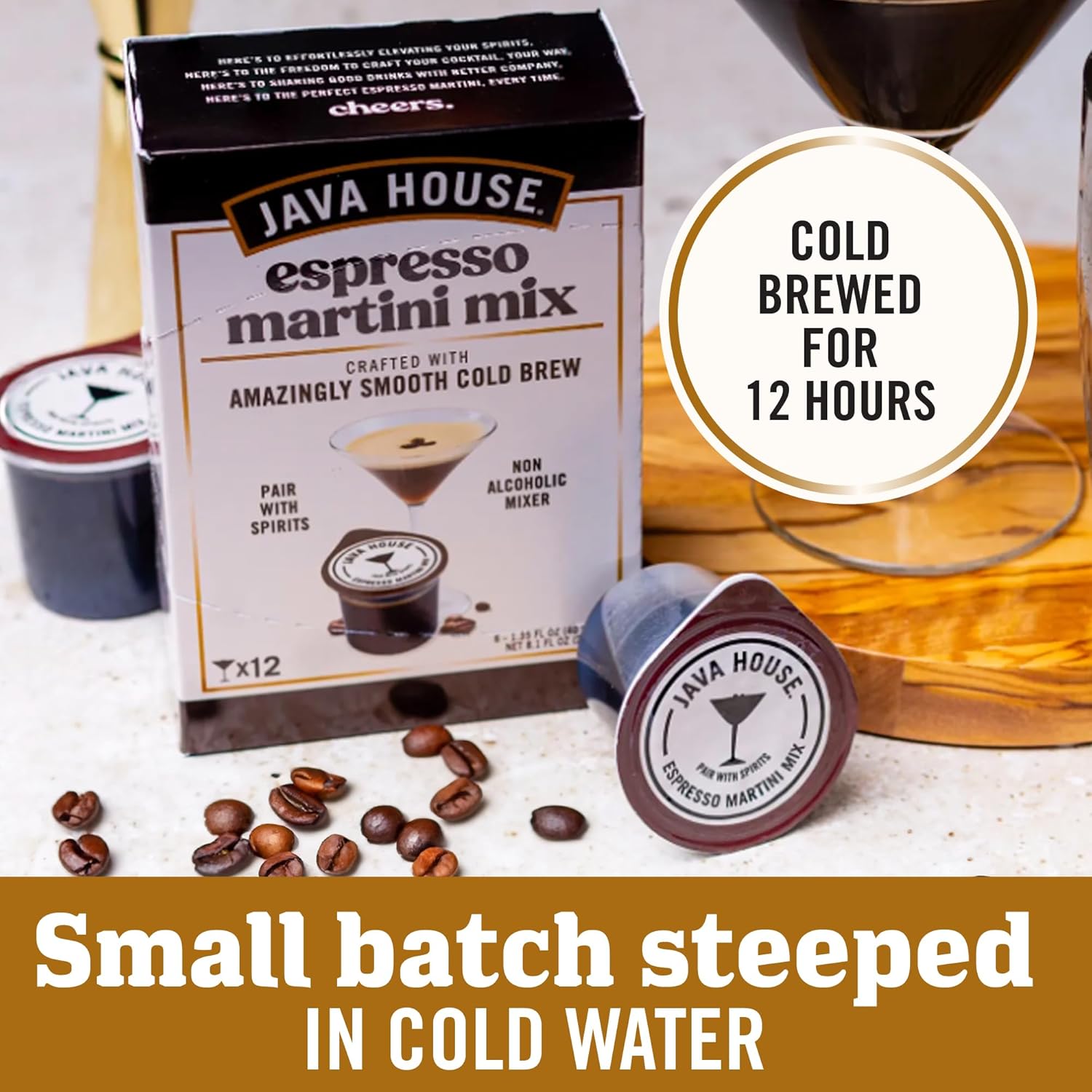 Java House Cold Brew Espresso Martini Mix Peel and Pour Pods with coffee pods and packaging displayed on a wooden surface.