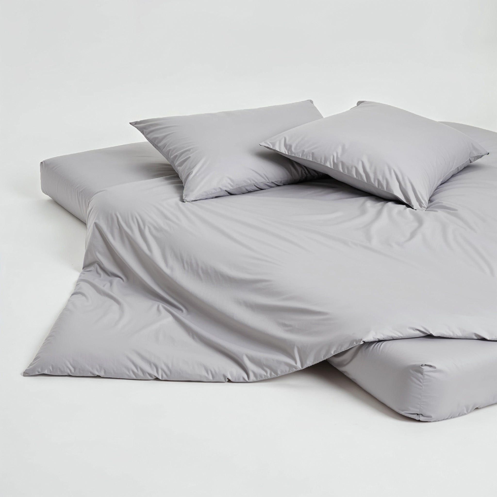Soft beige Luxe Australian Sateen Duvet Cover by Italic, showcasing smooth, luxurious fabric on a neatly made bed.