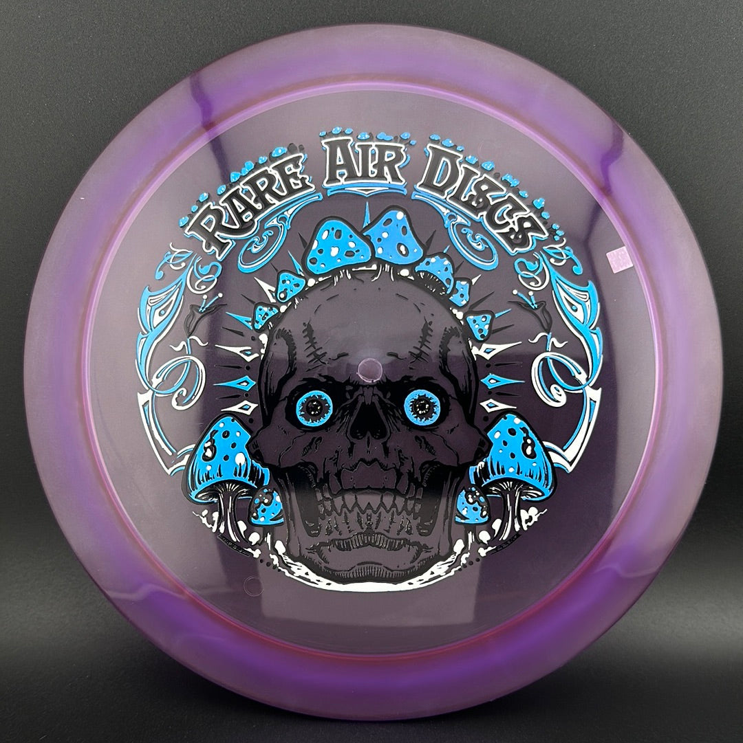 Rare Air Discs Ethos Construct Crushin' Amanitas disc golf stamp by Manny Trujillo on disc with colorful mushroom illustration.
