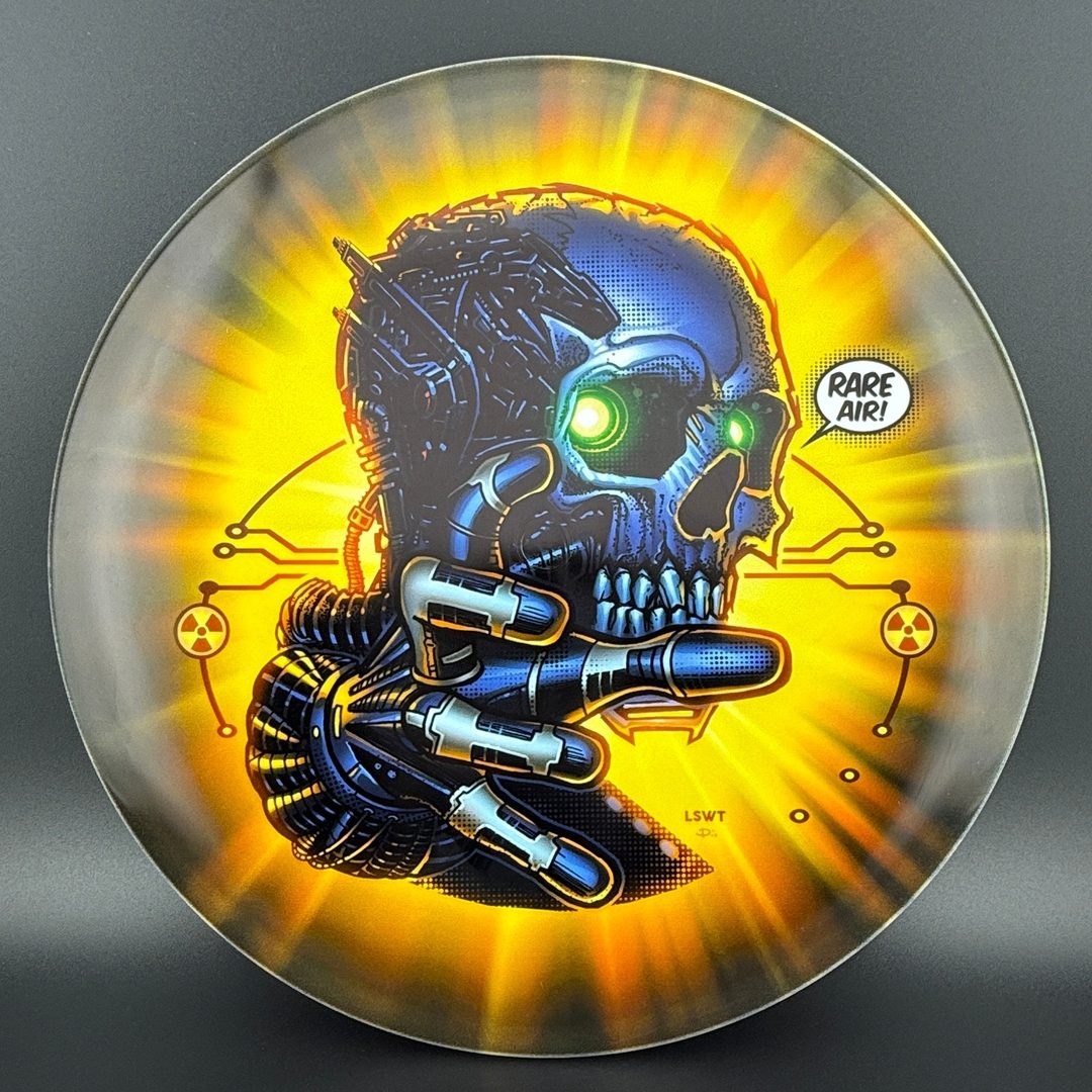 Gold Pure disc golf disc from Rare Air Discs, branded as [STRATUS] FEAR V3 by Les White & Dan Kemp, showing a close-up of the disc.