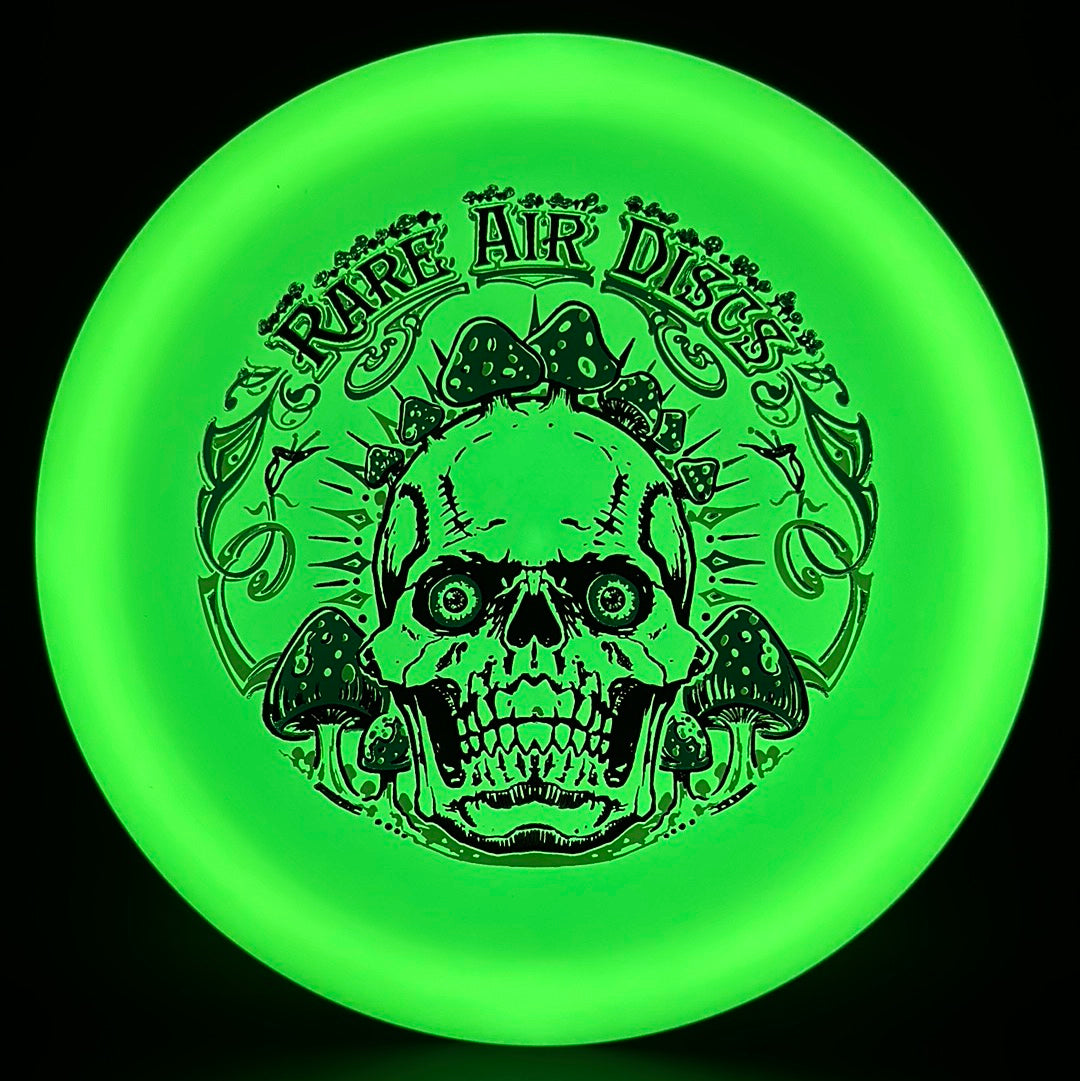 Forged Radiant Era Crushin' Amanitas disc golf stamp by Manny Trujillo on a Rare Air Discs disc with detailed artwork.