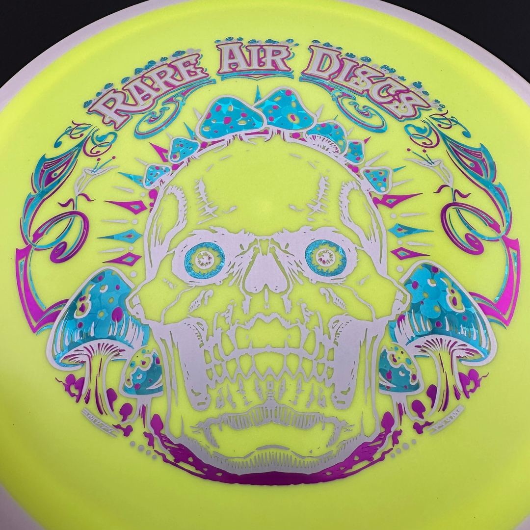 Rare Air Discs Fission Defy Crushin' Amanitas VIP 2.0 disc golf disc with vibrant design and branding visible.
