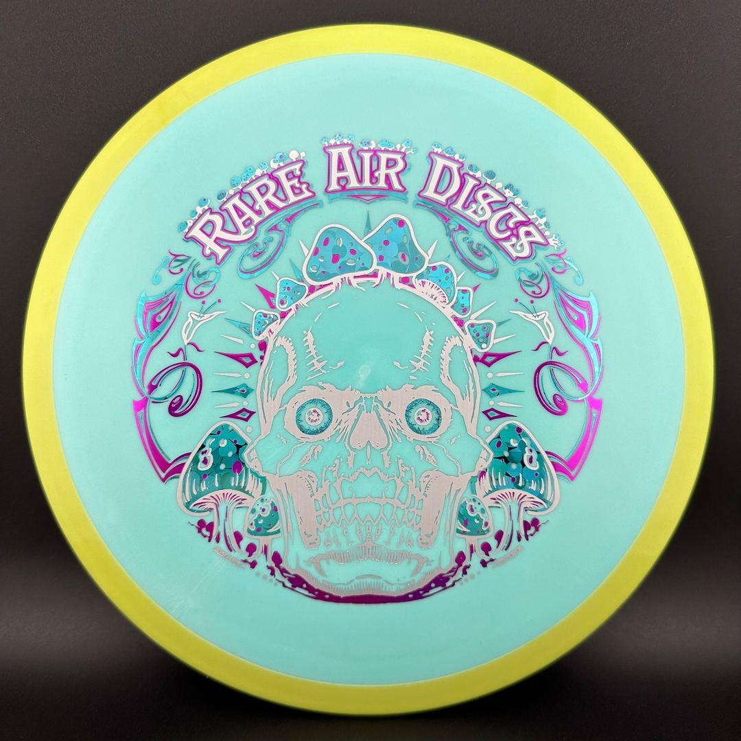 Rare Air Discs Fission Defy Crushin' Amanitas VIP 2.0 disc golf disc with vibrant design and bold branding.