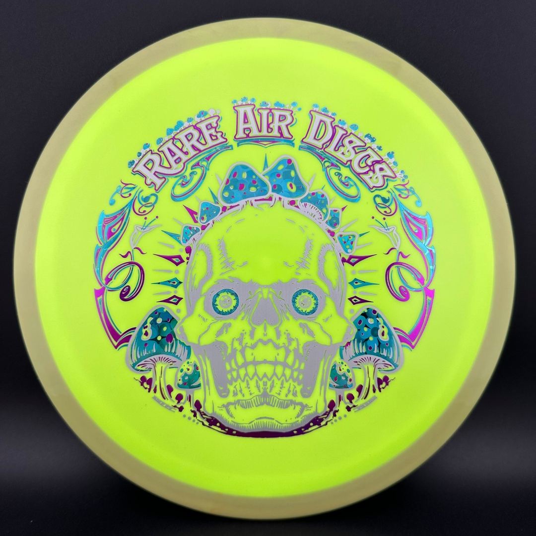 Fission Defy Crushin' Amanitas VIP 2.0 disc golf disc by Rare Air Discs, featuring colorful artwork and aerodynamic design.