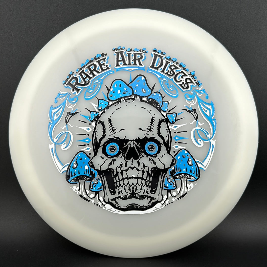 Forged Radiant Era Crushin' Amanitas disc golf stamp by Manny Trujillo on a Rare Air Discs disc showing vibrant, detailed artwork.