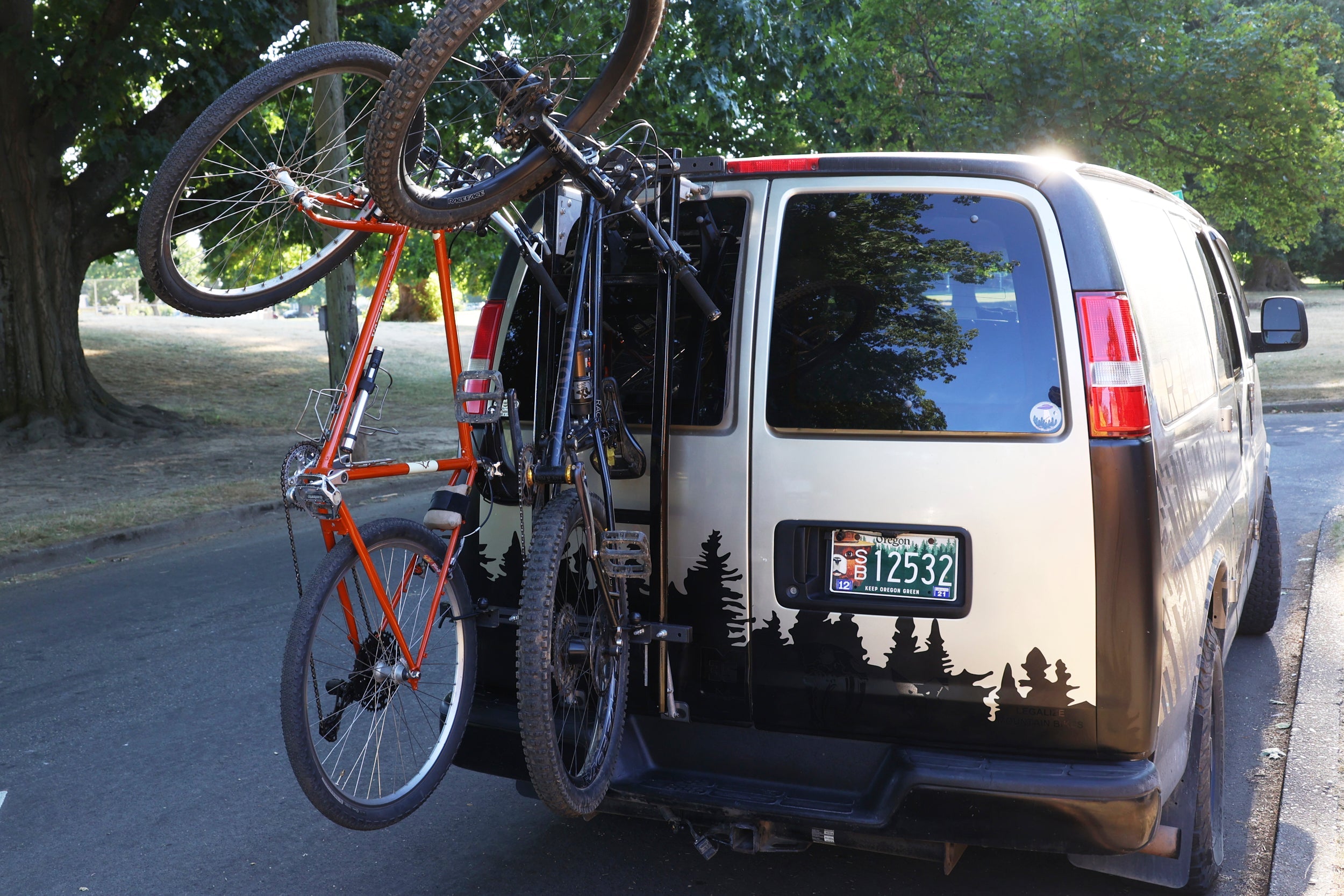 Lolo Racks Rad Lad rear ladder bike rack kit mounted on vehicle, showing sturdy metal construction and secure mounting points.