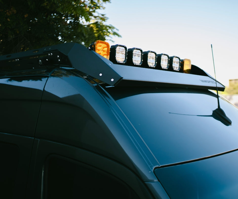 The Van Mart Sprinter Scout Rack 144 mounted on a van, showcasing its sturdy design and functionality for outdoor gear.