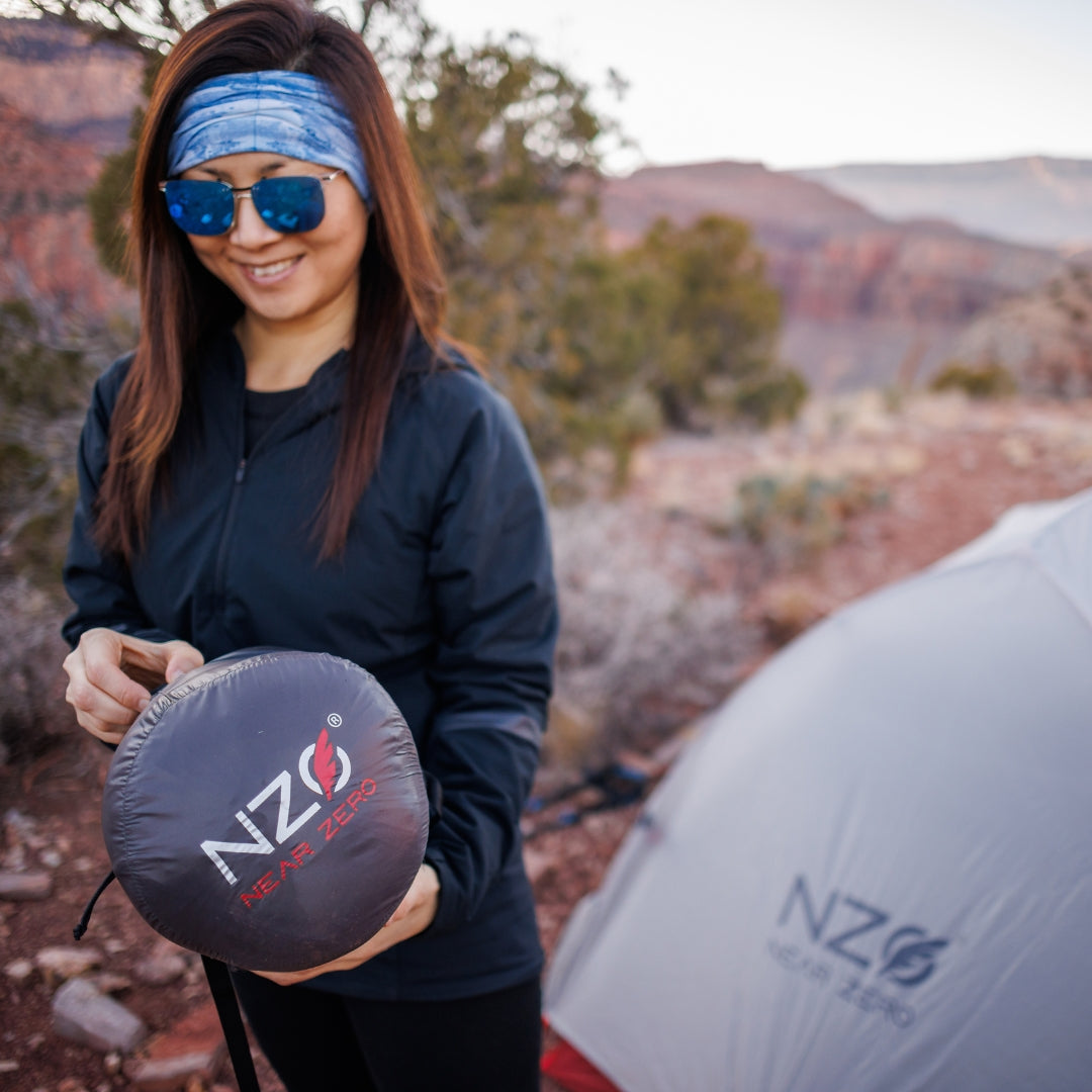 Near Zero Outdoor Gear Peralta 25 synthetic sleeping bag laid out, showcasing its insulated, lightweight design for camping and outdoor use.