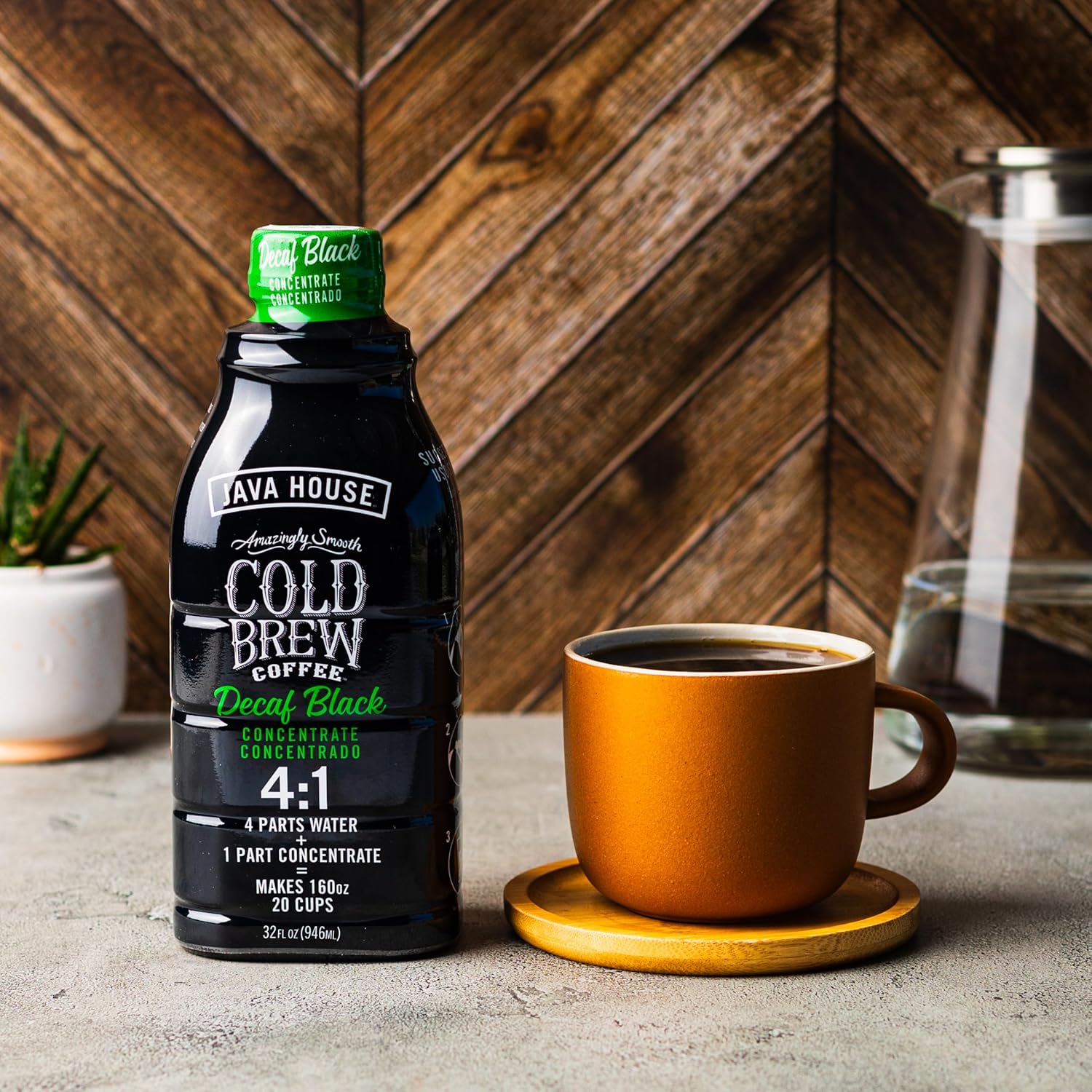 Java House Decaf Cold Brew concentrate in a bottle, showcasing a rich, dark liquid ready to be enjoyed.