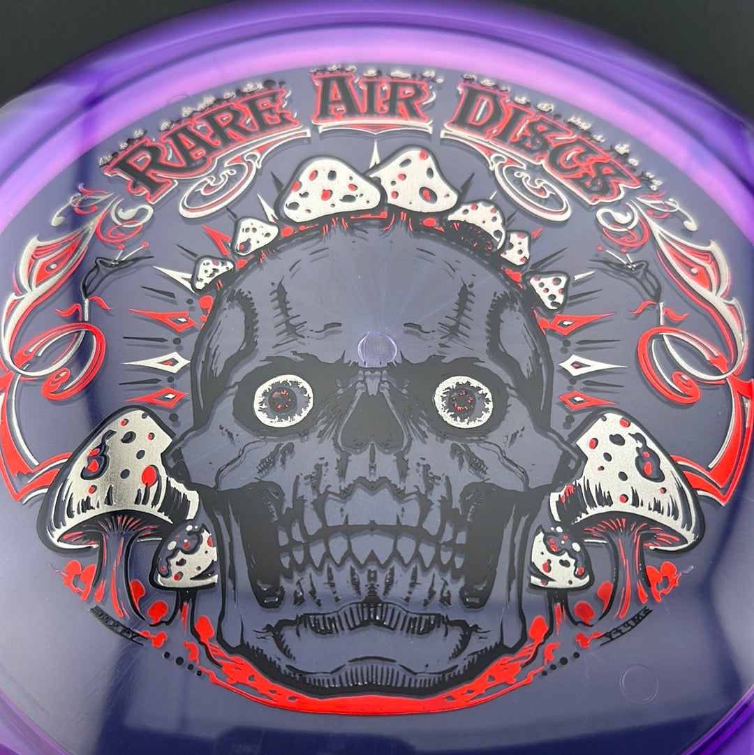 Ethos Construct Crushin' Amanitas disc golf stamp by Manny Trujillo on a Rare Air Discs disc, featuring colorful mushroom artwork.