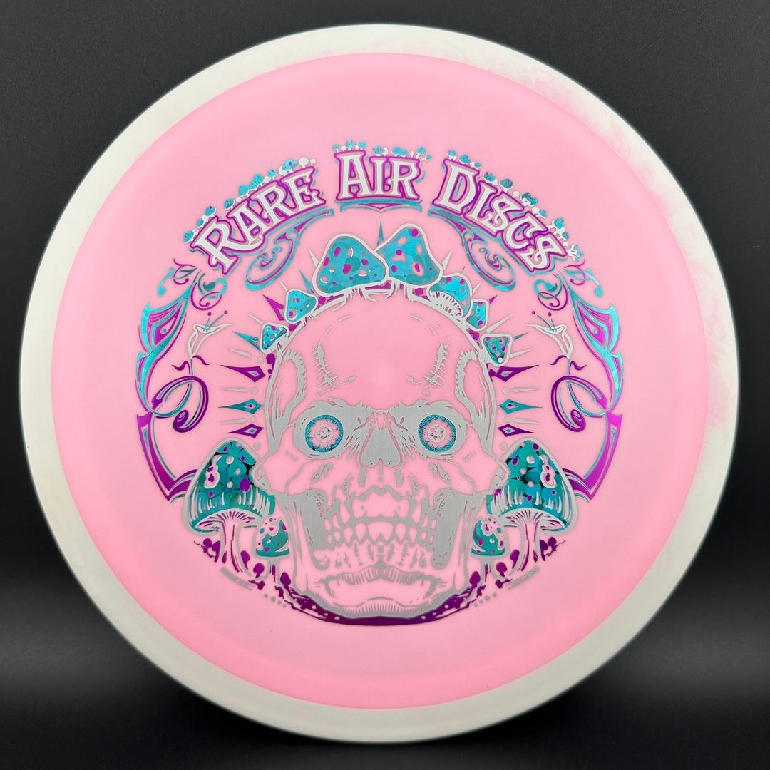 Disc golf disc Fission Defy Crushin' Amanitas VIP 2.0 by Rare Air Discs, showing colorful design and disc shape.