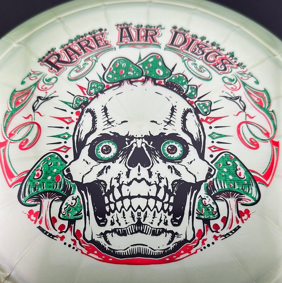 Ethereal Construct Crushin' Amanitas disc golf stamp by Manny Trujillo on a Rare Air Discs disc with vibrant, detailed artwork.