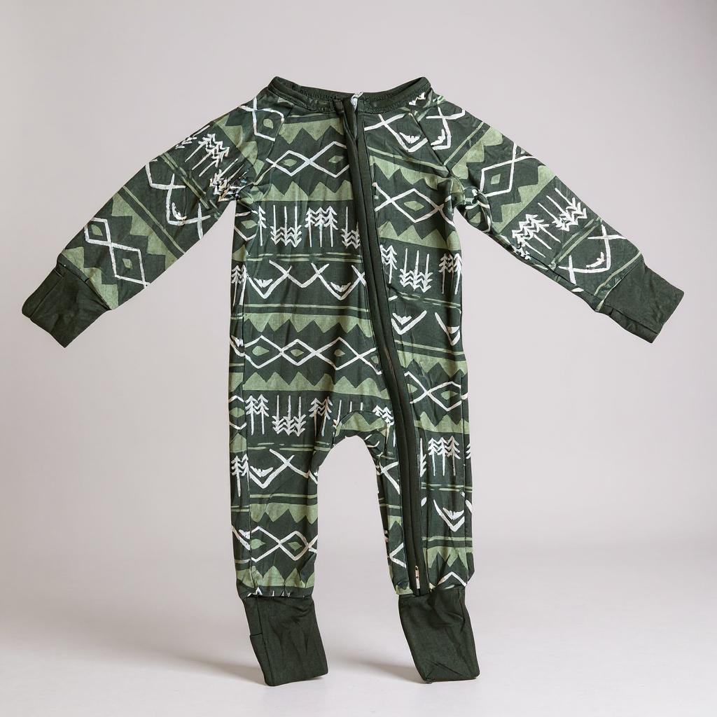 Green bamboo zippy pajamas for kids from Keep the Littles Wild, soft eco-friendly sleepwear with a playful design.