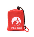 Pike Trail pocket blanket spread out on grass, compact and lightweight outdoor blanket for picnics and outdoor activities.