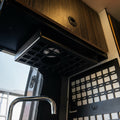 Revel undercabinet shelf by Canyon Adventure Vans, made in Utah, mounted under cabinet with visible wood finish and sturdy design.