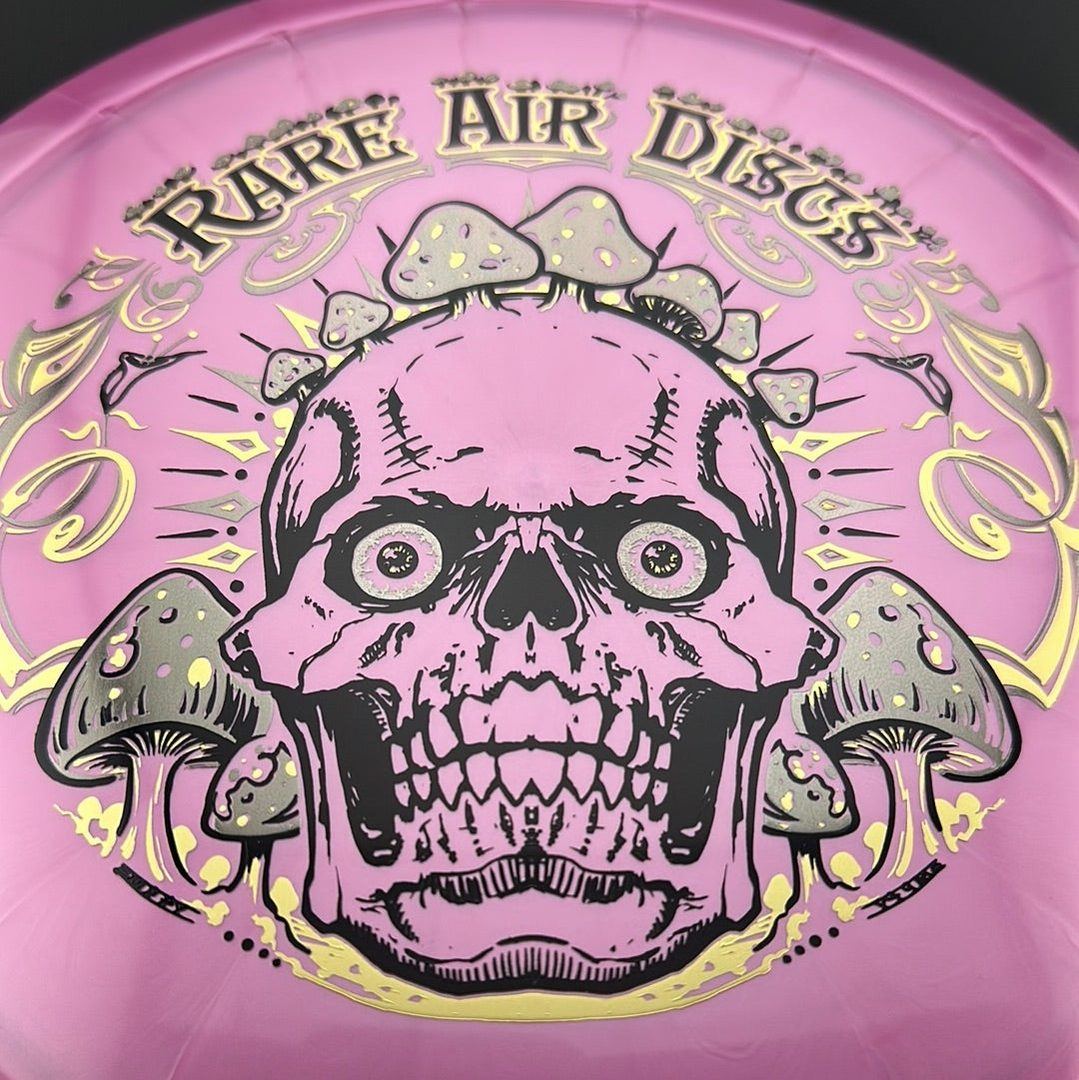 Disc golf stamp by Manny Trujillo featuring Ethereal Construct and Crushin' Amanitas on a Rare Air Discs disc.