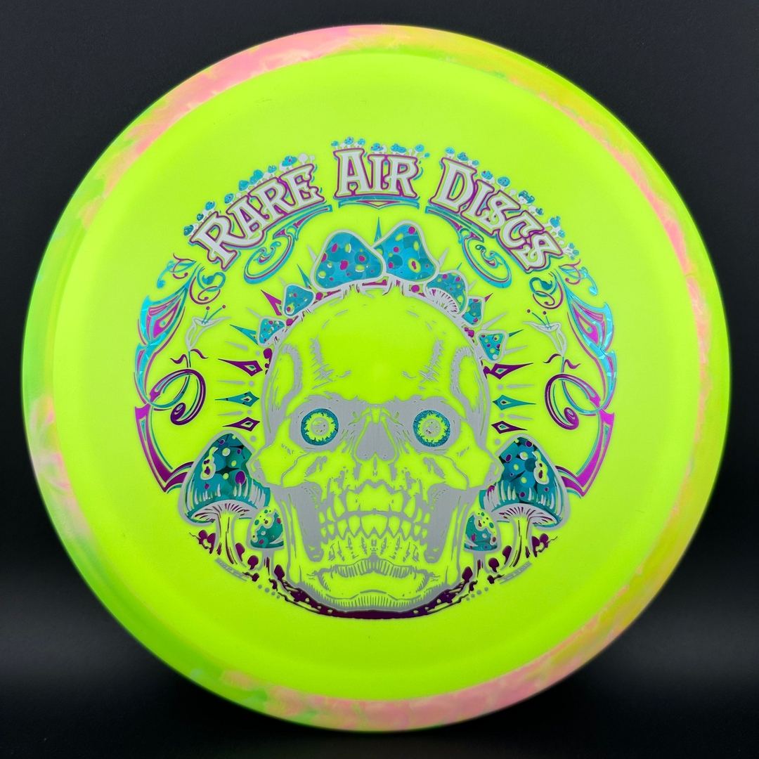 Rare Air Discs Fission Defy Crushin' Amanitas VIP 2.0 disc golf disc on a green background