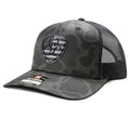 Ariat black camo embroidered shield trucker cap featuring mesh back and curved brim, casual headwear for outdoor activities.