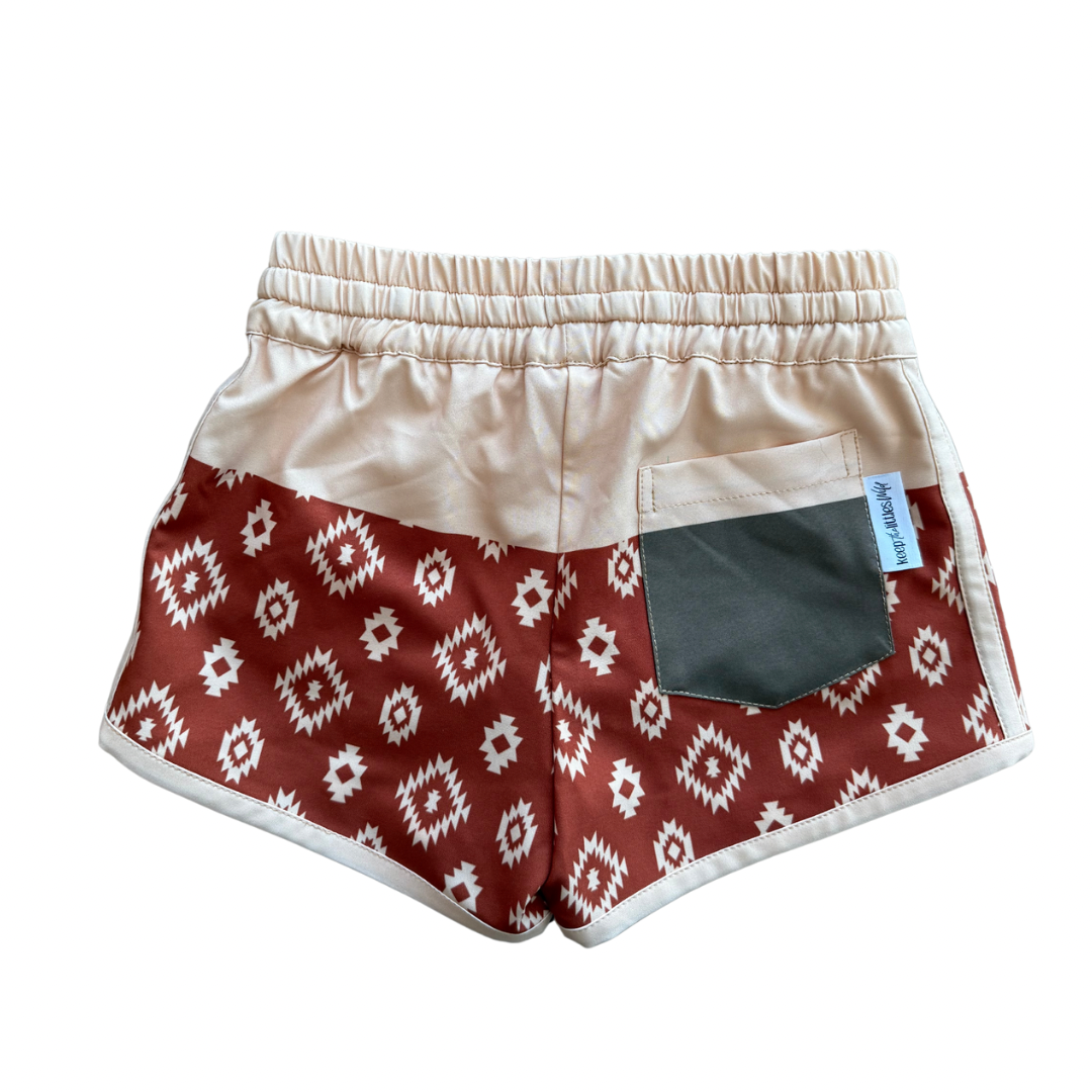 Color block hybrid shorts by Keep the Littles Wild featuring bold, vibrant color panels and a comfortable fit.