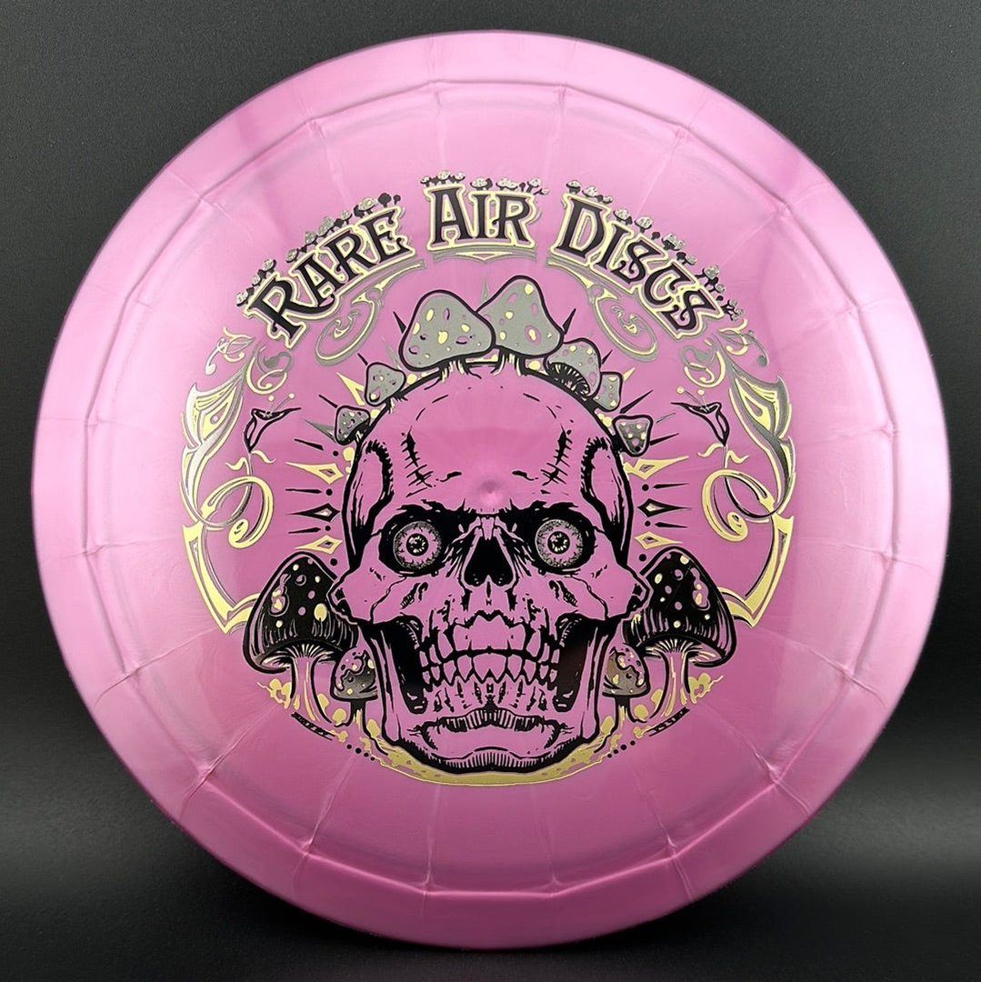 Ethereal Construct Crushin' Amanitas disc golf stamp by Manny Trujillo on a disc from Rare Air Discs, featuring vibrant mushroom artwork.