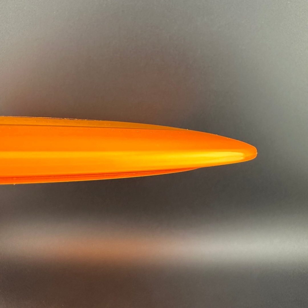 Gummy C-Blend Aztec disc golf driver by Rare Air Discs, showing bright yellow plastic with detailed Aztec design.