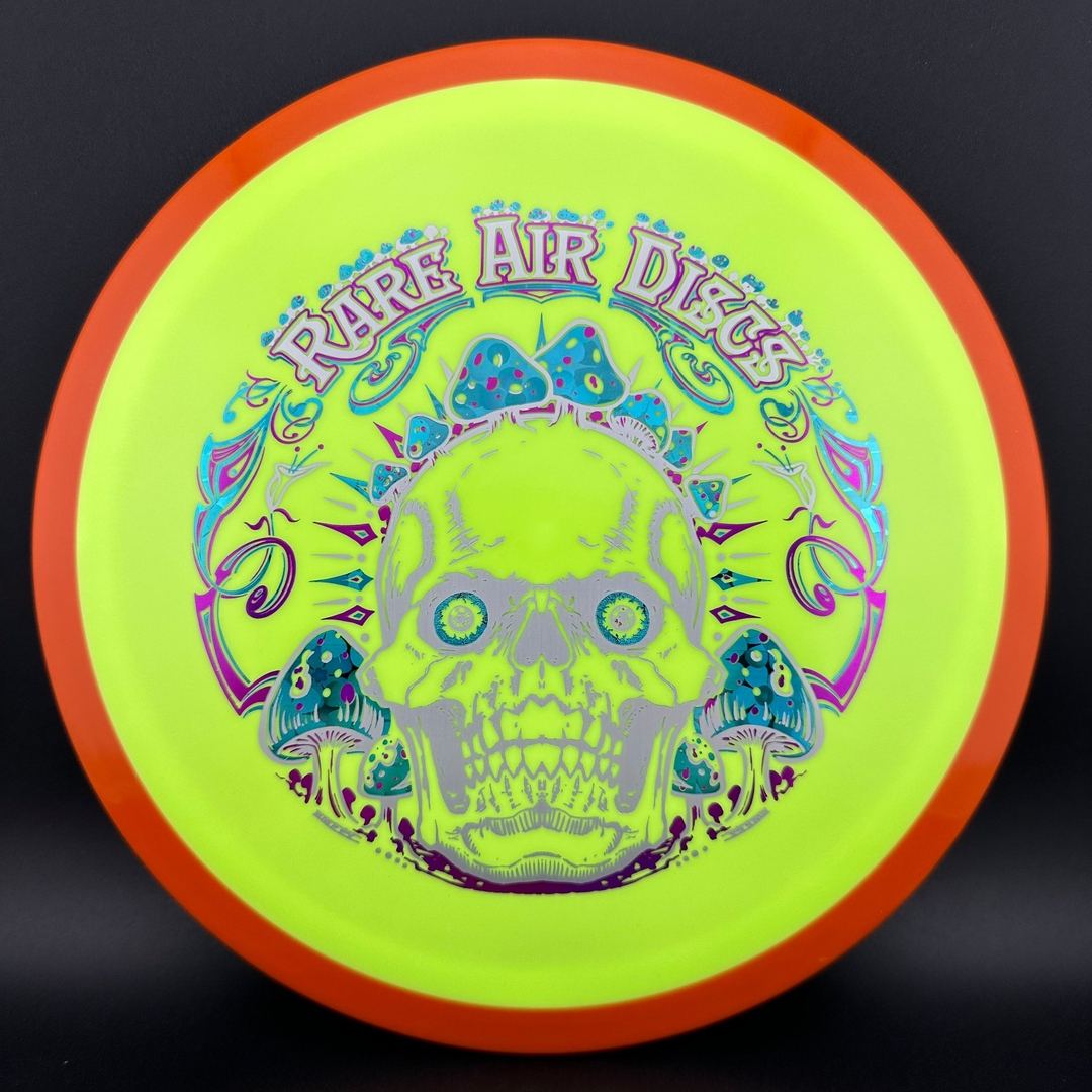 Fission Defy Crushin' Amanitas VIP 2.0 disc golf disc by Rare Air Discs, featuring vibrant artwork and bright colors.