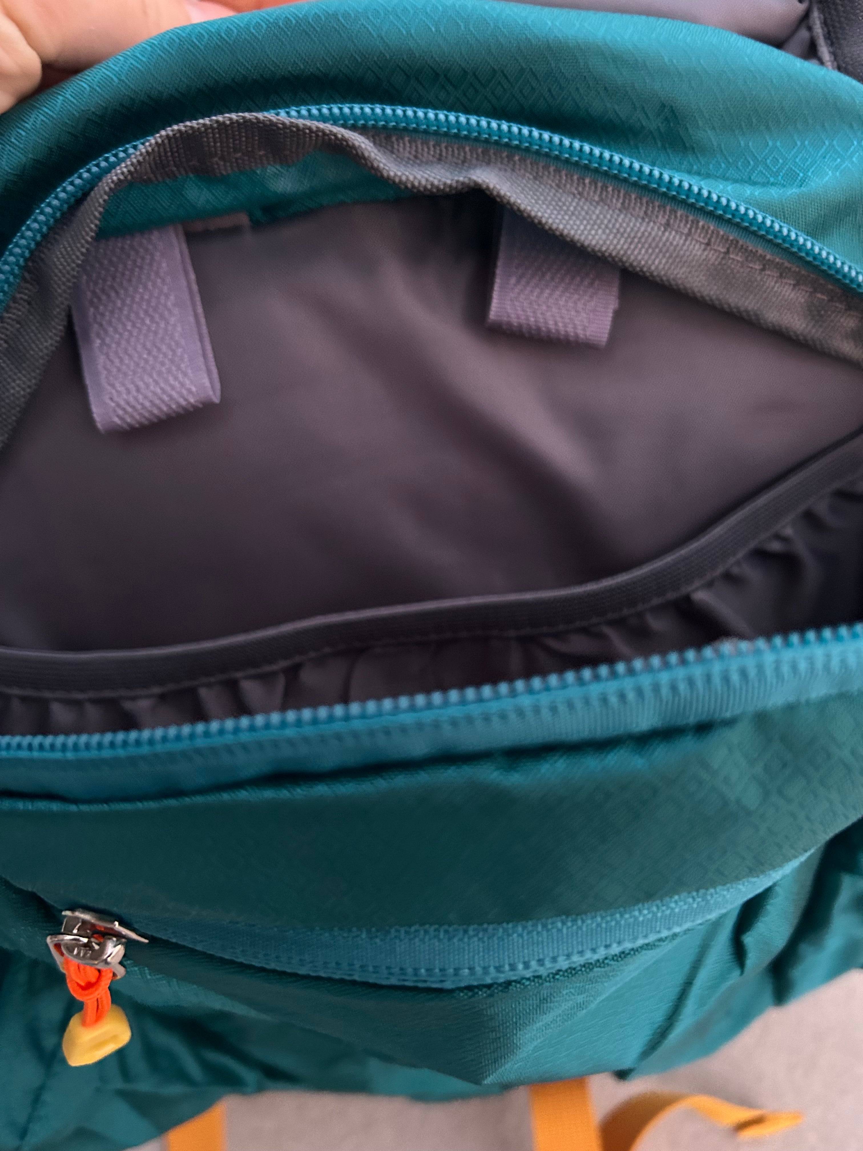 Kid’s teal hiking backpack for ages 2-7, Keep the Littles Wild with water bladder compatibility and adjustable straps.