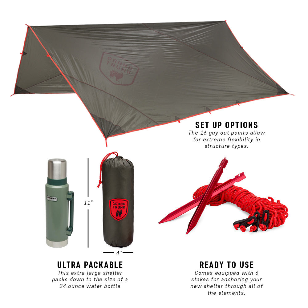 GrandTrunk Abrigo Rain Fly and Shelter set up outdoors, showcasing lightweight waterproof shelter for camping and rain protection.
