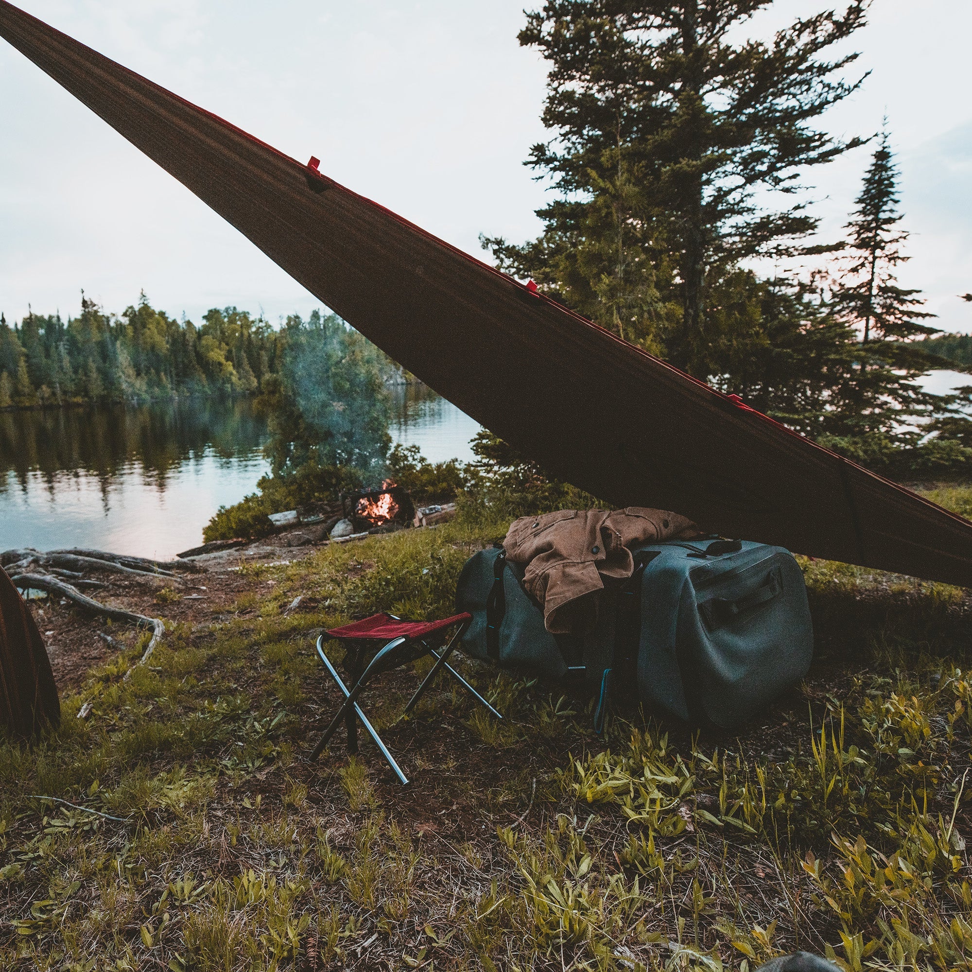 GrandTrunk Abrigo Rain Fly and Shelter set up outdoors showing waterproof fabric and sturdy support poles for camping protection.
