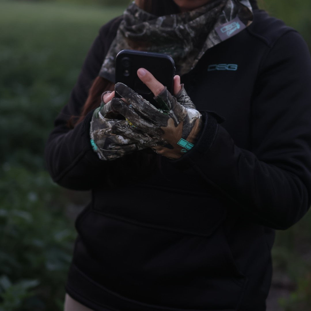 Lightweight feather weight glove by DSG OUTERWEAR, showing a close-up of the soft, insulated glove material and stitching details.