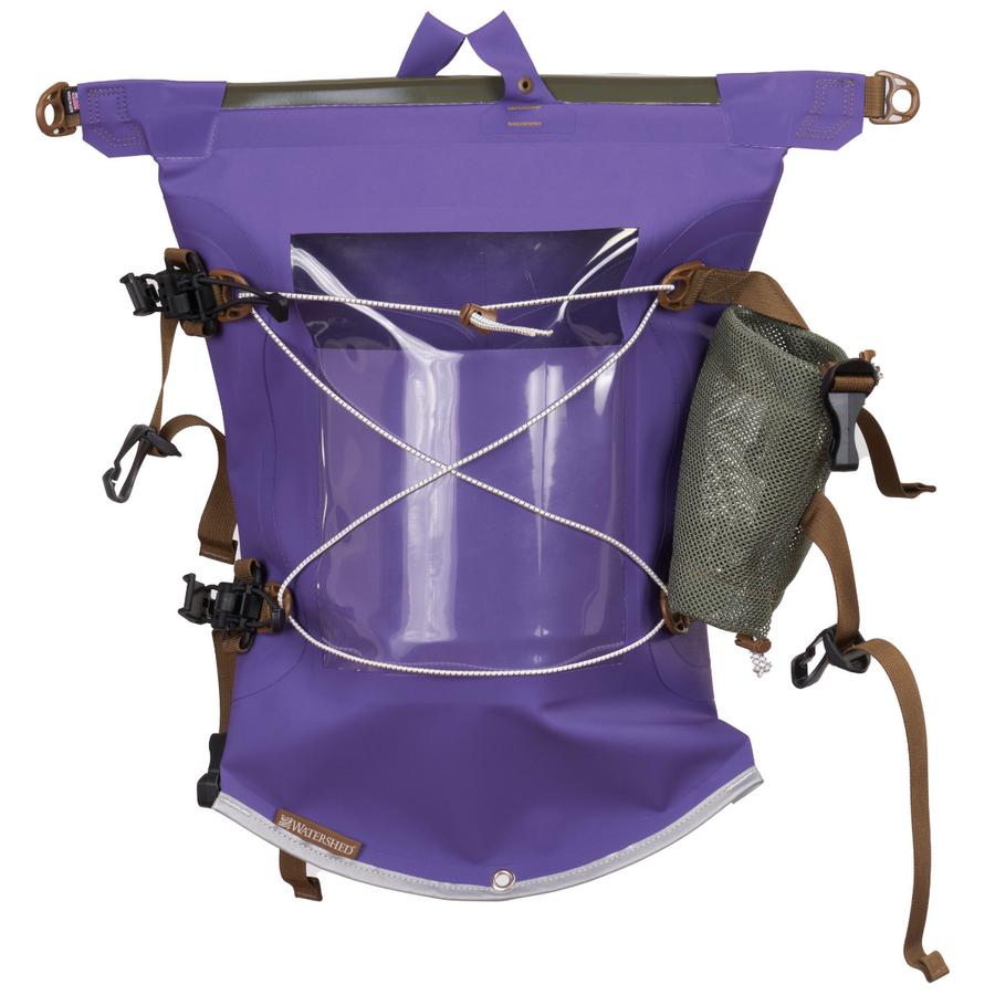 A purple waterproof backpack shown on a white background, featuring a clear front window, white rope bungees, brown straps, and an olive green mesh side pouch.