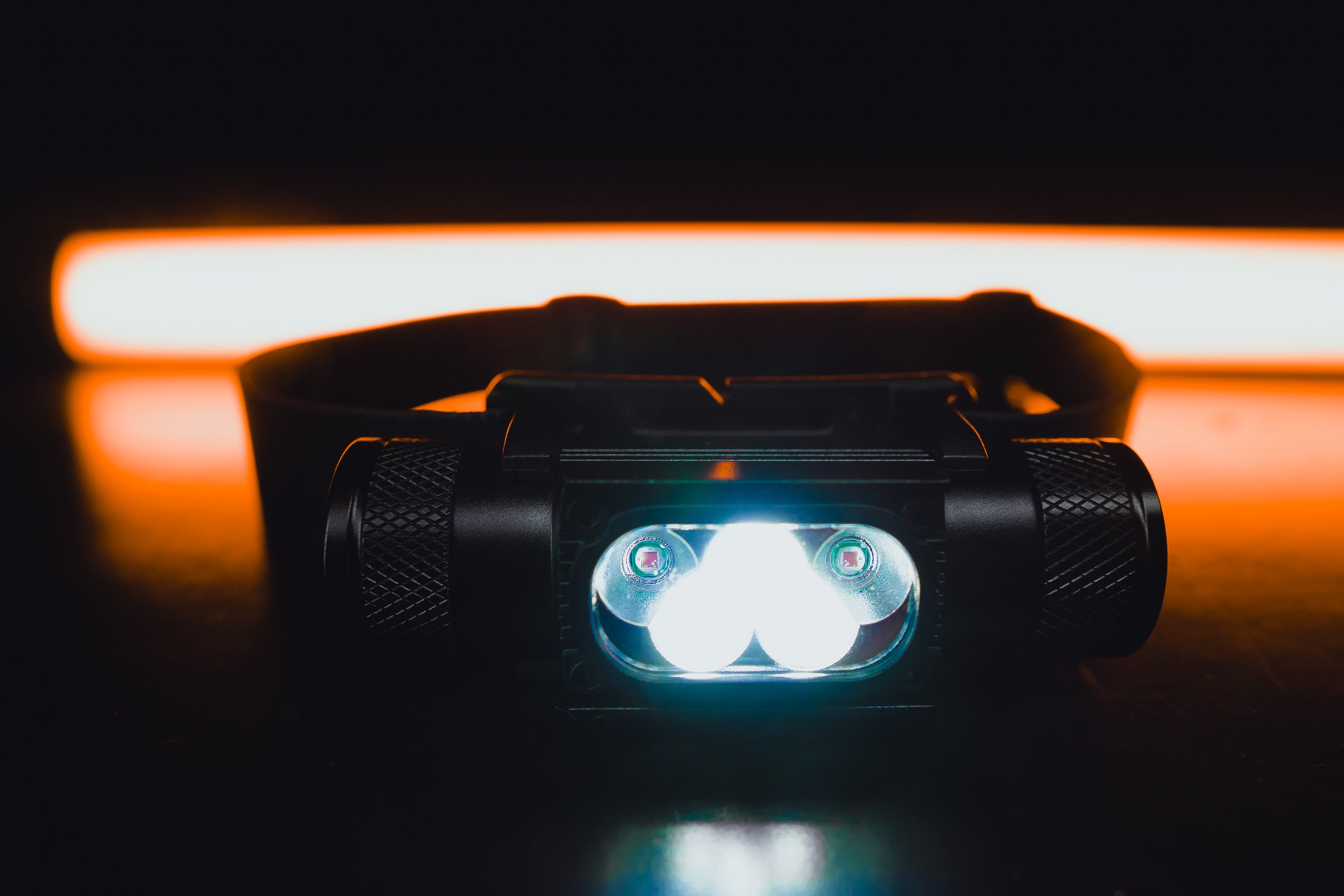 Black Strike 1800 headlamp by Last Light LLC with adjustable straps and bright LED light for outdoor activities.
