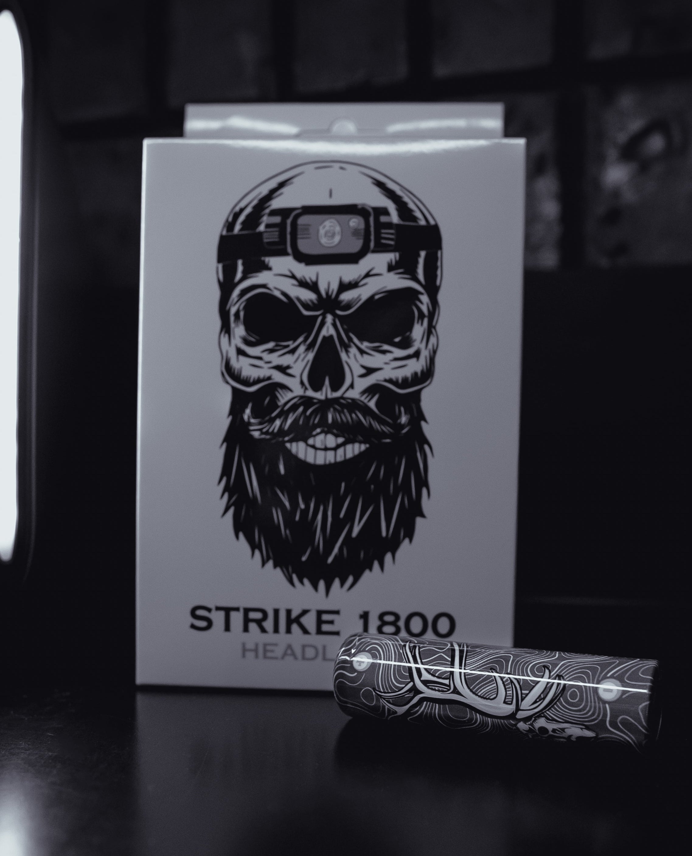 Last Light LLC STRIKE 1800 extra battery, compact rechargeable battery for compatible devices, shown in black plastic casing.