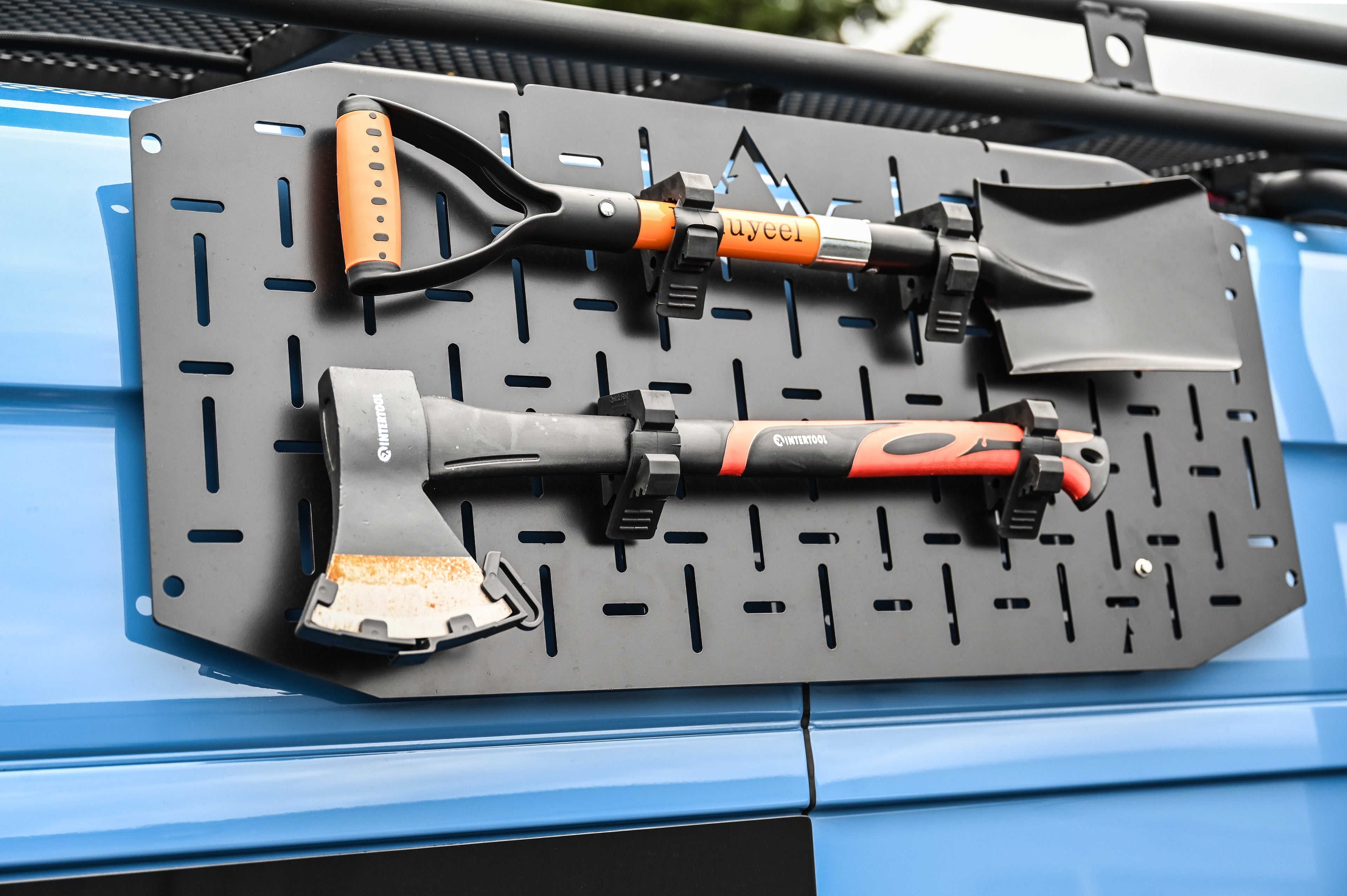 Alpine Van Works Alpaca Cargo Plate™️ mounted on a Sprinter van, exterior aluminum component for improved cargo access and protection.