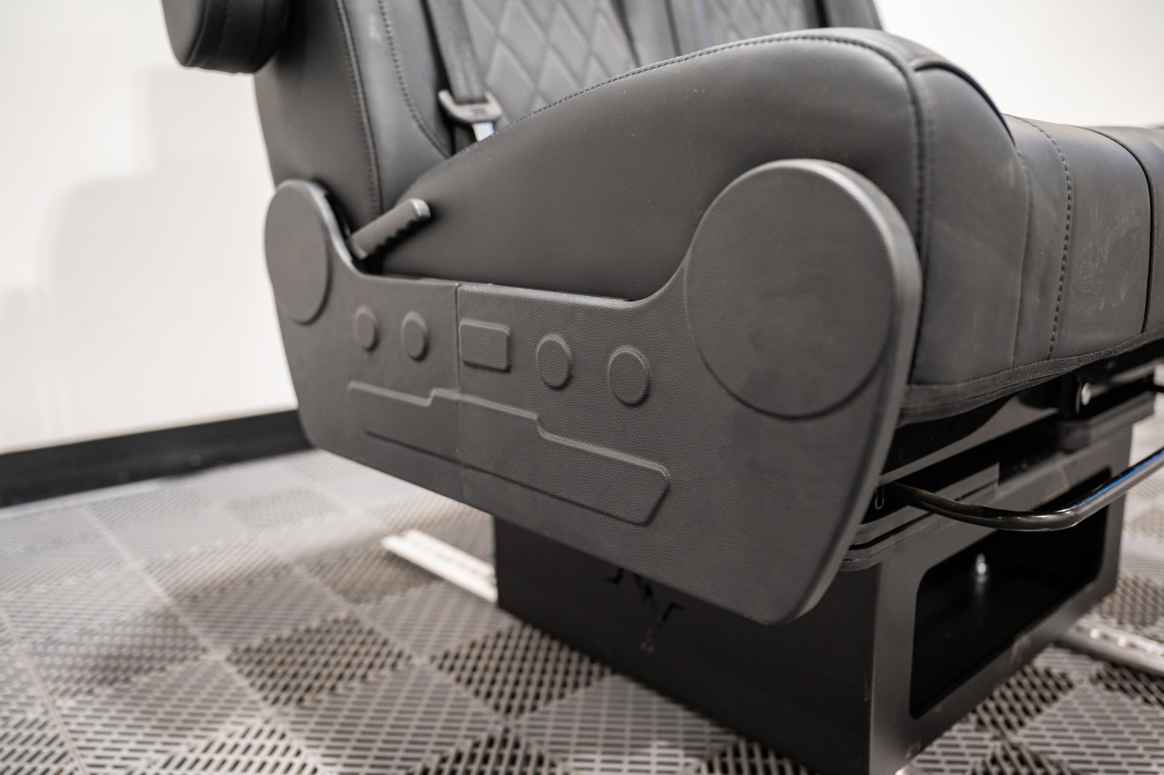 Dual fold double bench-to-bed seat by Alpine Van Works, LLC, showing the versatile seating and sleeping design in a vehicle conversion.