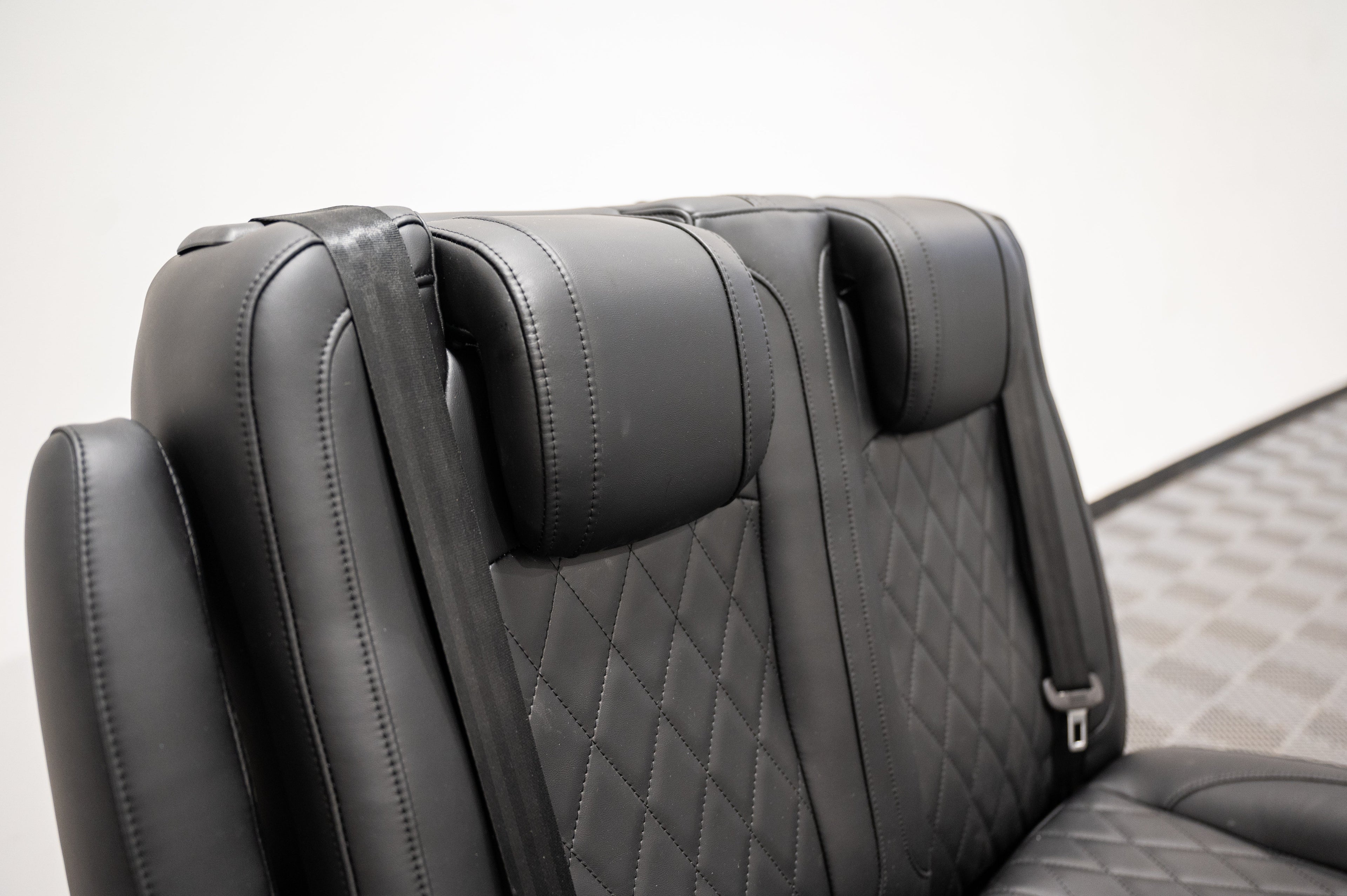 Alpine Van Works dual fold double bench-to-bed seat, portable seating with convertible design for vans or small spaces.