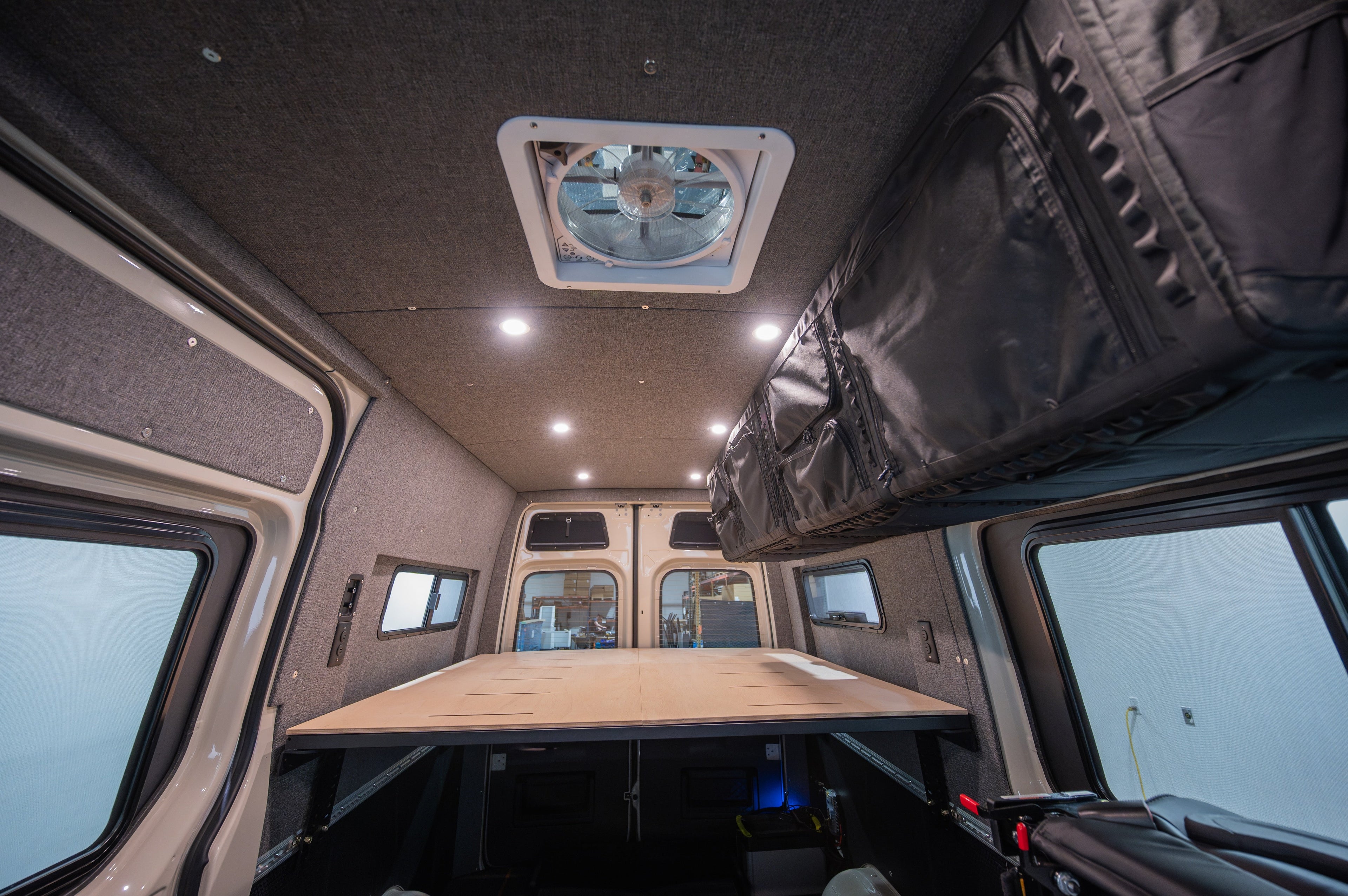 Mercedes Sprinter 170" high roof interior panel kit in Heather Gray by Alpine Van Works, LLC, showing panel details and texture.