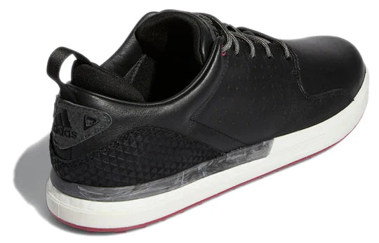 Adidas FLOPSHOT spikeless golf shoes in black with white accents, designed for comfort and traction on the golf course.