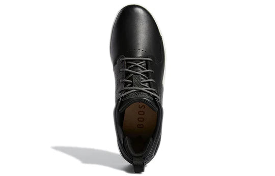 Adidas FLOPSHOT spikeless golf shoes in black with white accents, designed for comfort and grip on the golf course.