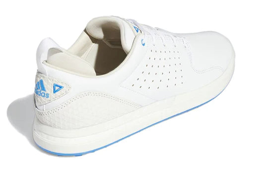 Adidas FLOPSHOT spikeless golf shoes in black and white with white soles, designed for comfort and stability on the course.