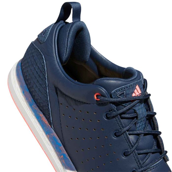 Adidas FLOPSHOT spikeless golf shoes in black with white accents, designed for comfort and stability on the golf course.