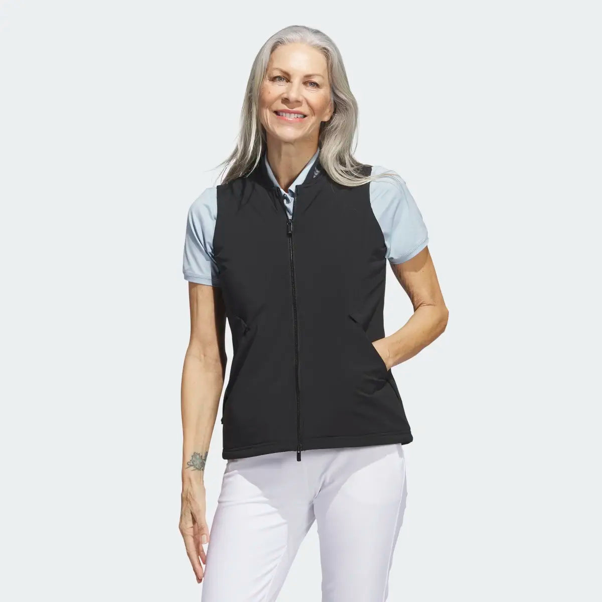 Adidas Ultimate365 Tour Frostguard vest in black, lightweight golf clothing with a high collar and zip closure for cold weather.