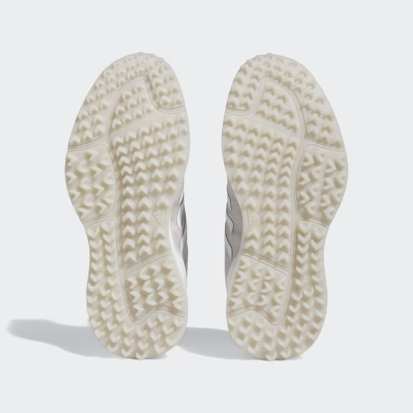 Adidas women's S2G golf shoes in white and black with breathable mesh and spiked rubber outsole for outdoor golf course play.
