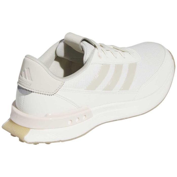 Adidas women's S2G Spikeless 24 golf shoes with white and navy design, breathable upper, and grip sole for golf course performance.
