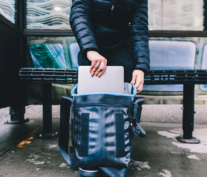 Alchemy Goods Haversack satchel made from recycled bike tubes, vegan, with adjustable strap and sturdy design, in a natural outdoor setting.