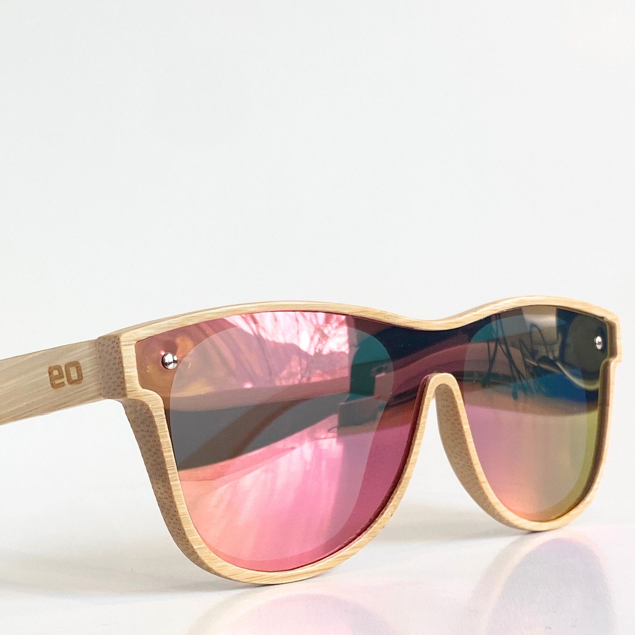 Close-up of Eastern Outer Alejandra bamboo sunglasses showing round frames and natural bamboo material.